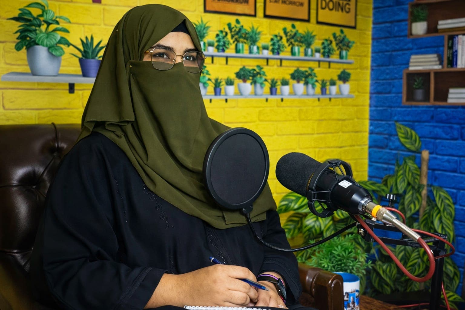 Zainab Siddique recording a podcast on mental health